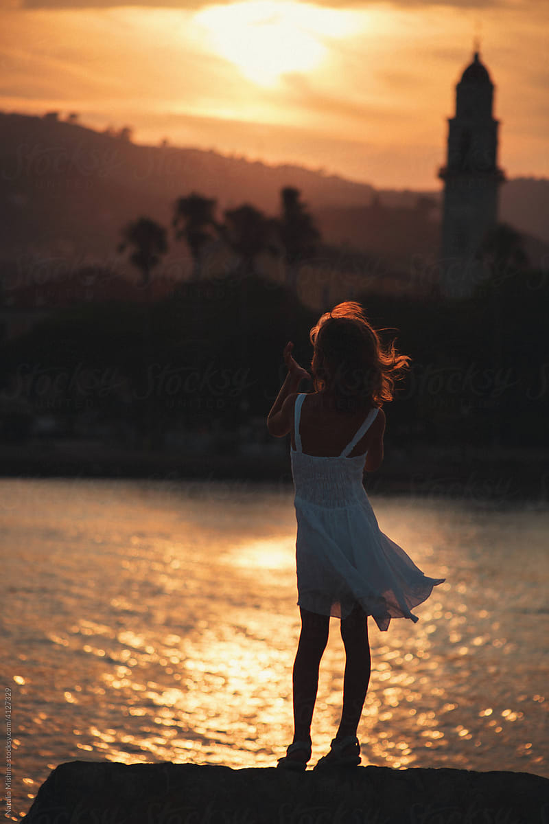 A girl on the beach, sunset.