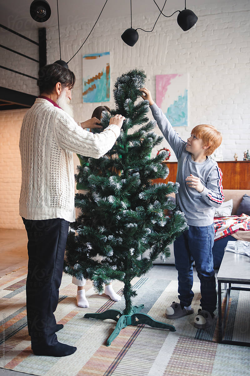 Christmas family tree children grandfather decorate celebrate boomer