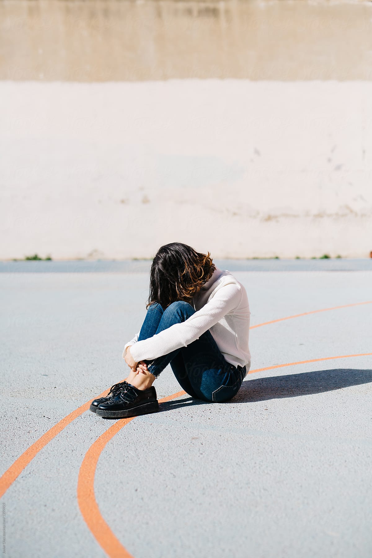 Woman Hiding Face In Knees By Stocksy Contributor Javier Díez Stocksy 