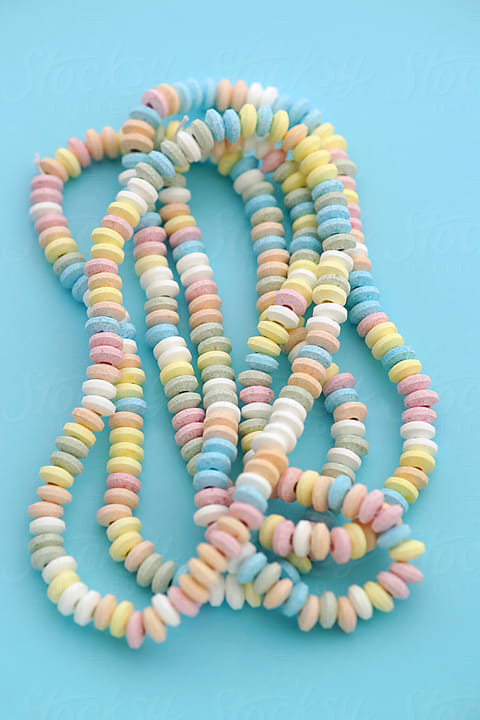 Candy Necklace Blue Pastel Colored Background Stock Photo by