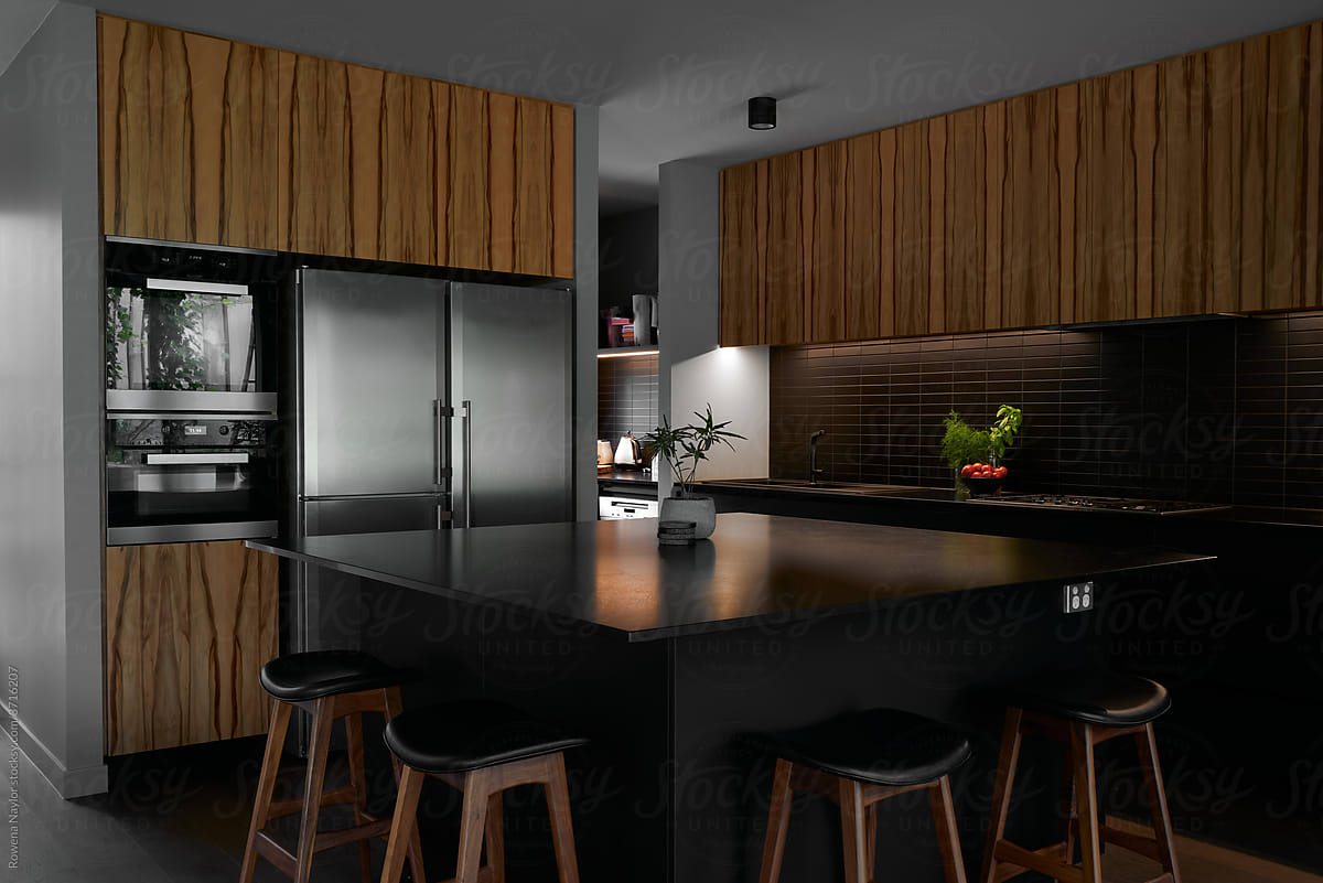 Kitchen with large island bench in black marble