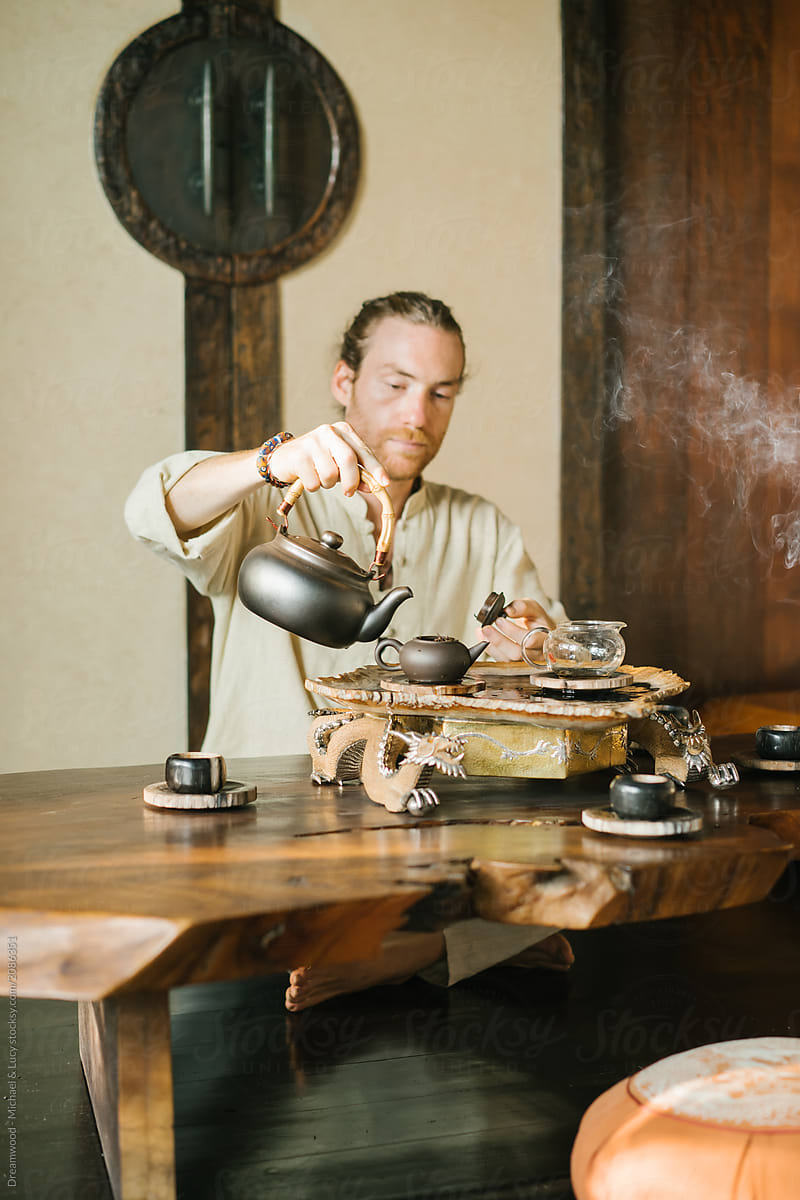 Man conducting oriental traditional tea ceremony