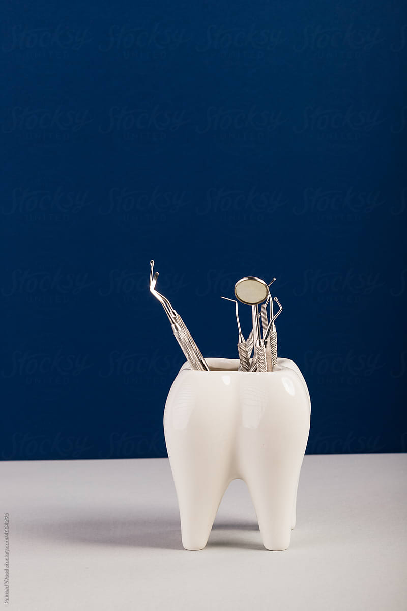 huge tooth with dental equipment