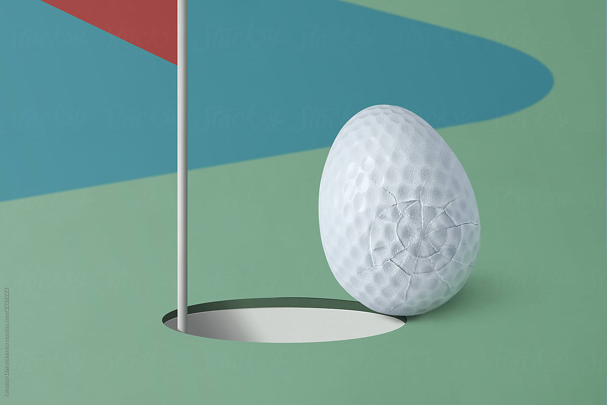 Golf ball in the form of eggs near the hole on a blue-green field with copy space
