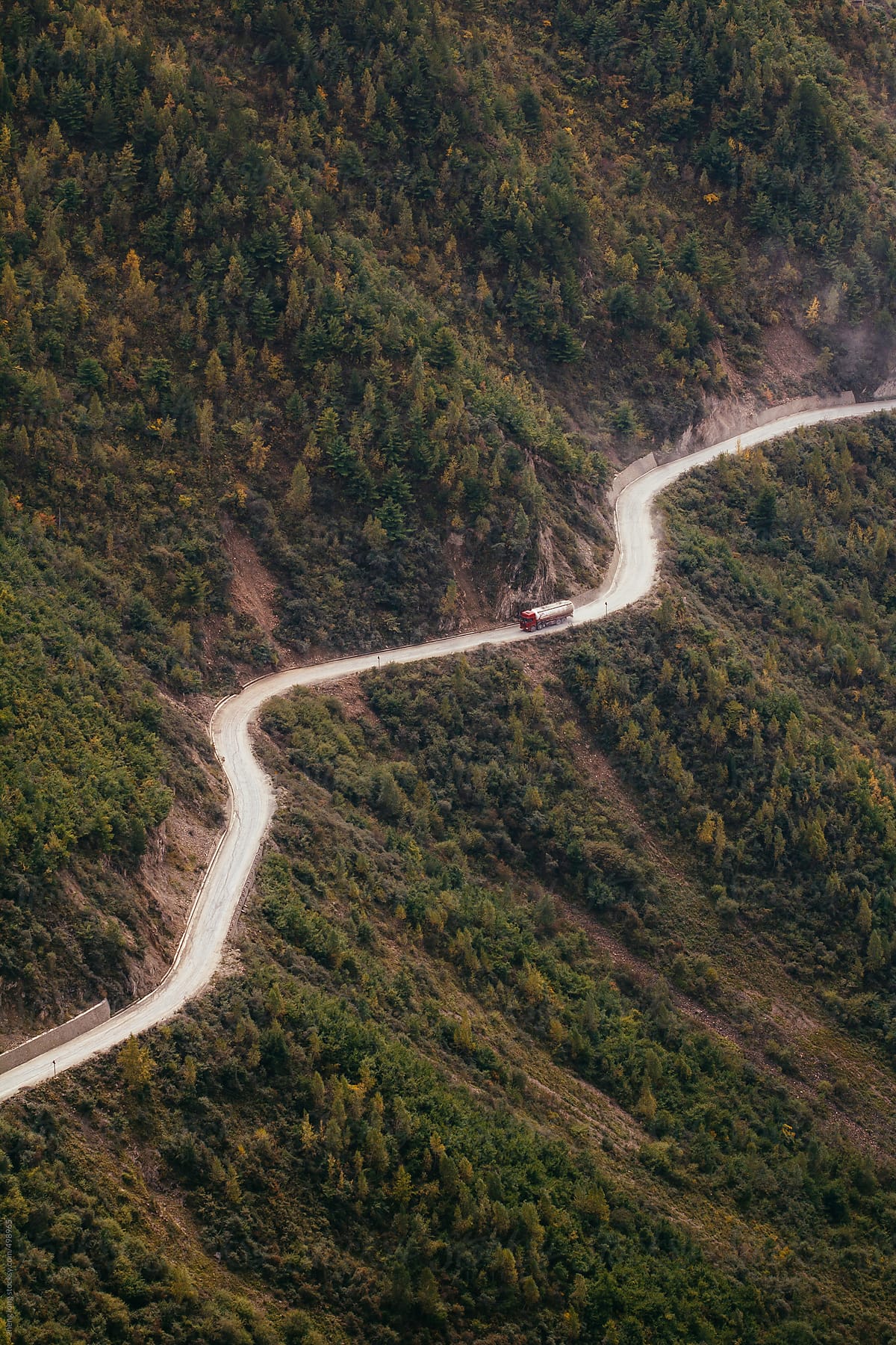 car running on the mountain road in Tibet