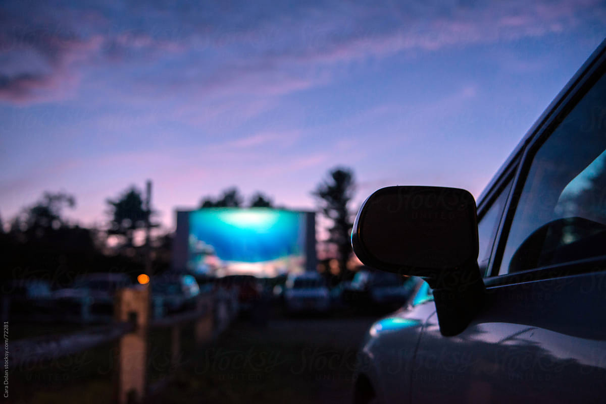 Dusk falls at the drive-in movie theatre