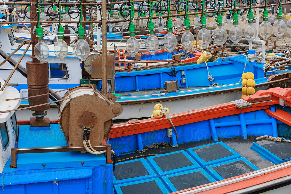 Blue fishing boats close-up.