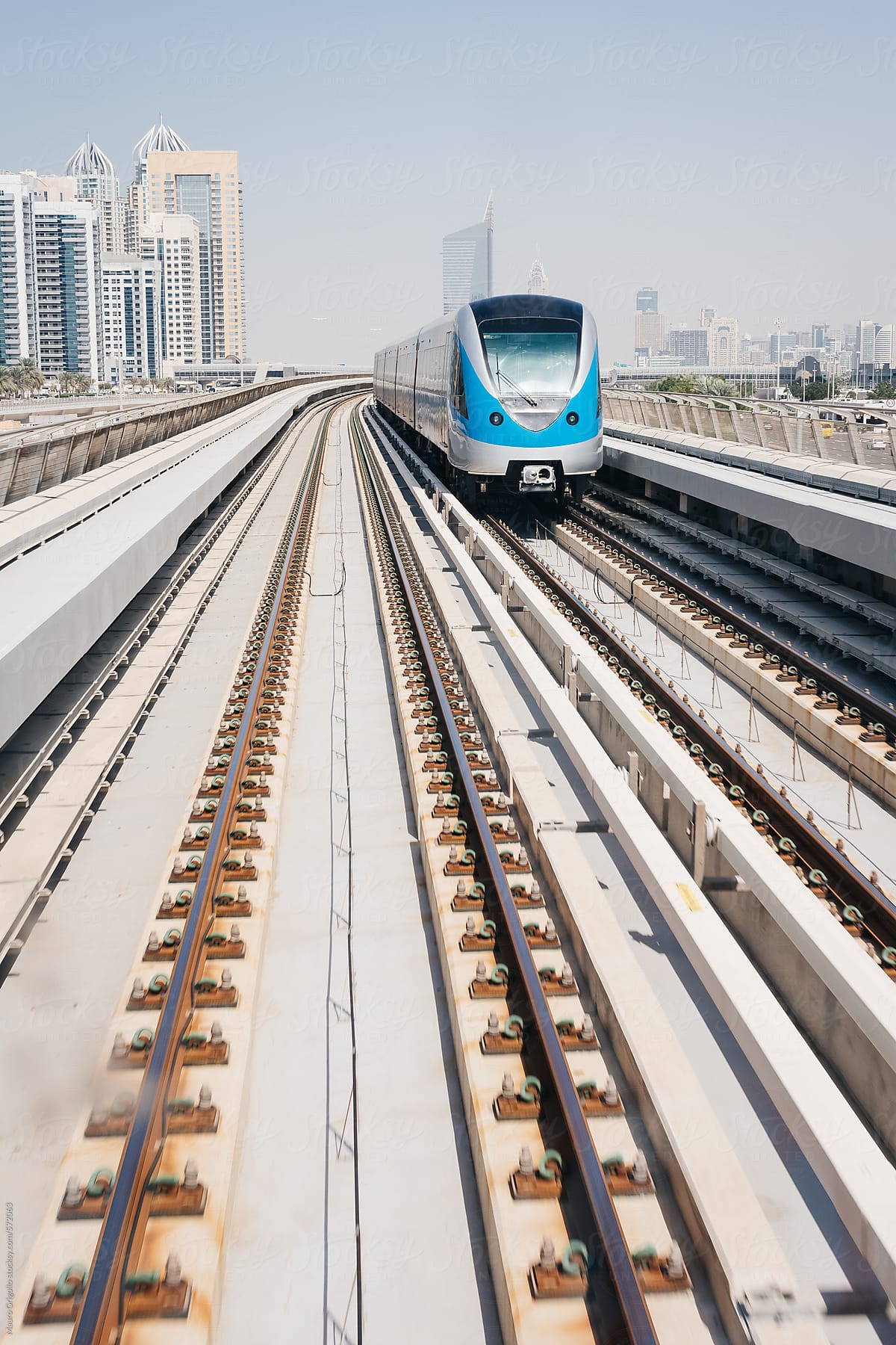 Train and city buildings view in Dubai. United Arab Emirates.