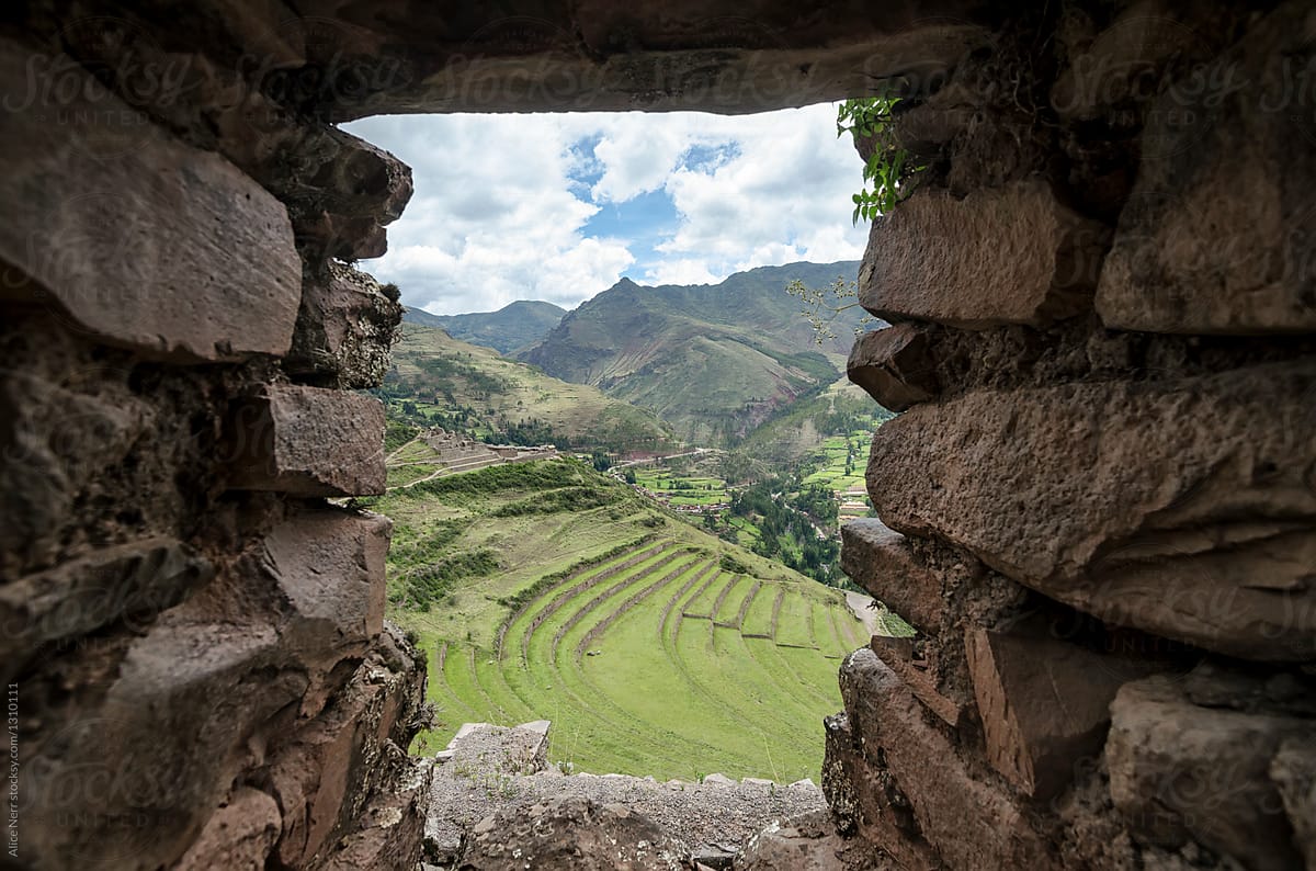 Inca\'s ruins and view to agricultural terraces through the windo