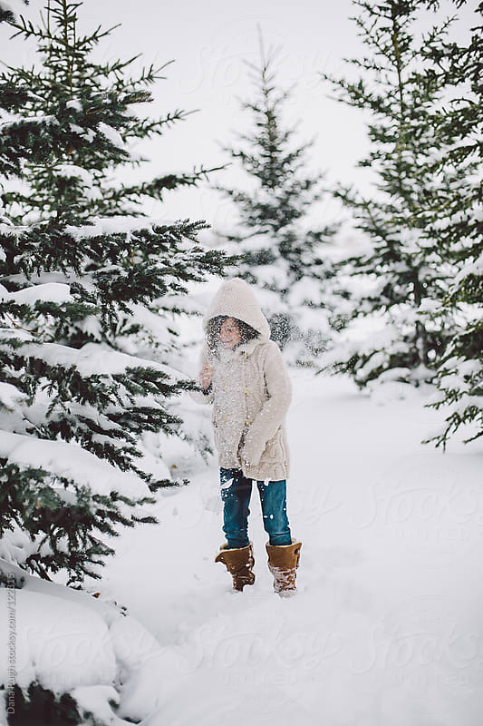 Girl Playing in the snow. by Dana Pugh - Stocksy United
