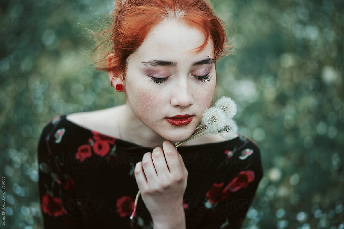 Portrait of a beautiful ginger haired woman with freckles
