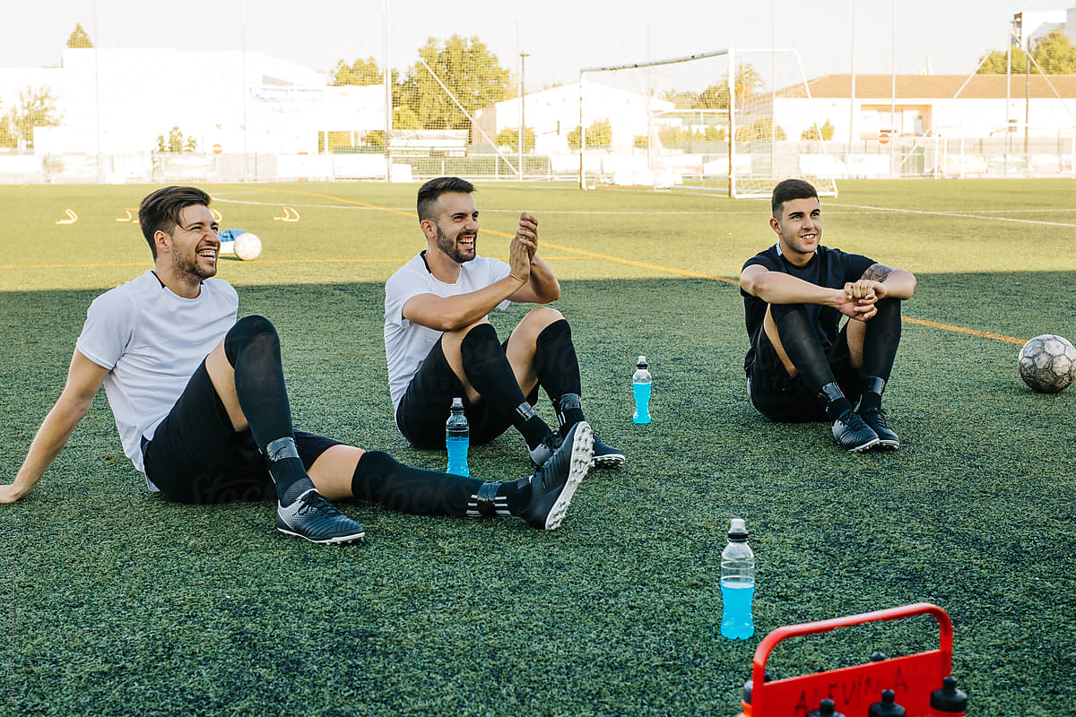 Soccer players resting during training