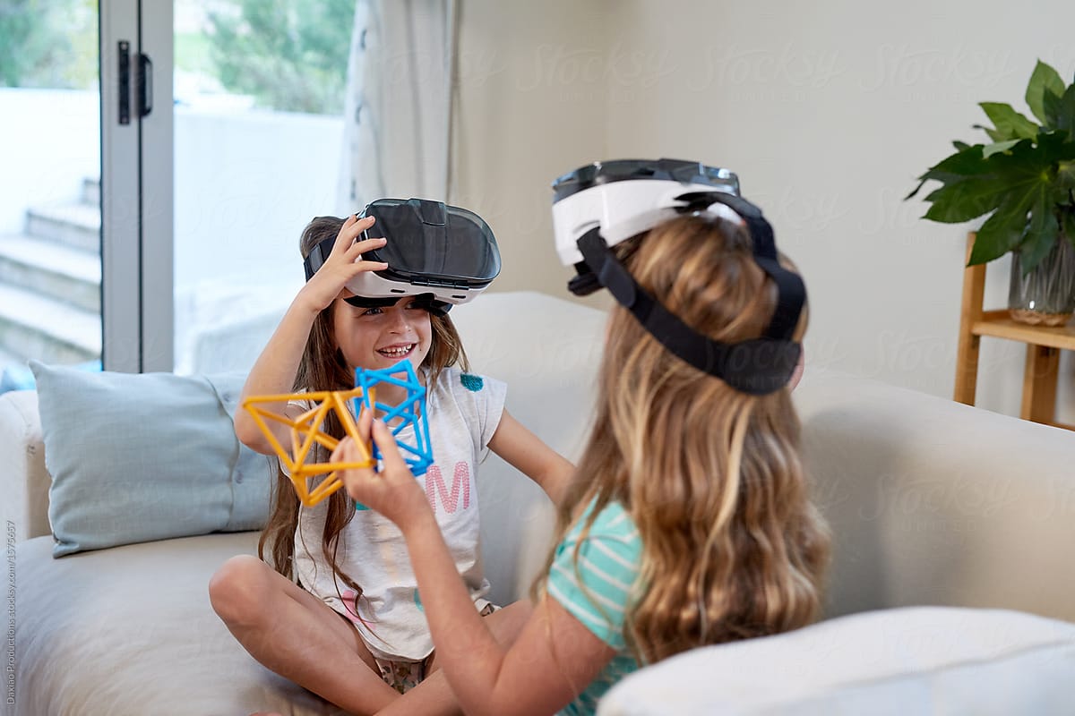 Happy children playing with VR goggles headset