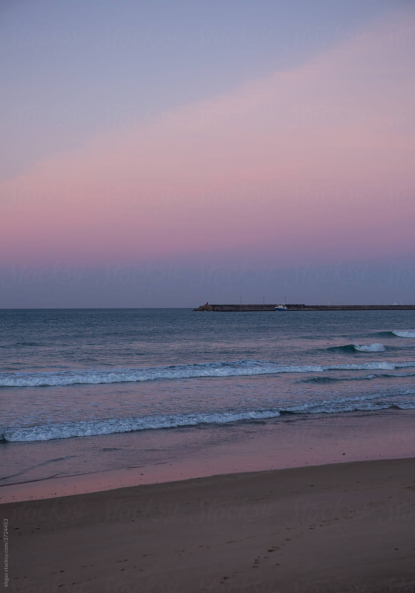 Pink dawn and ocean waves
