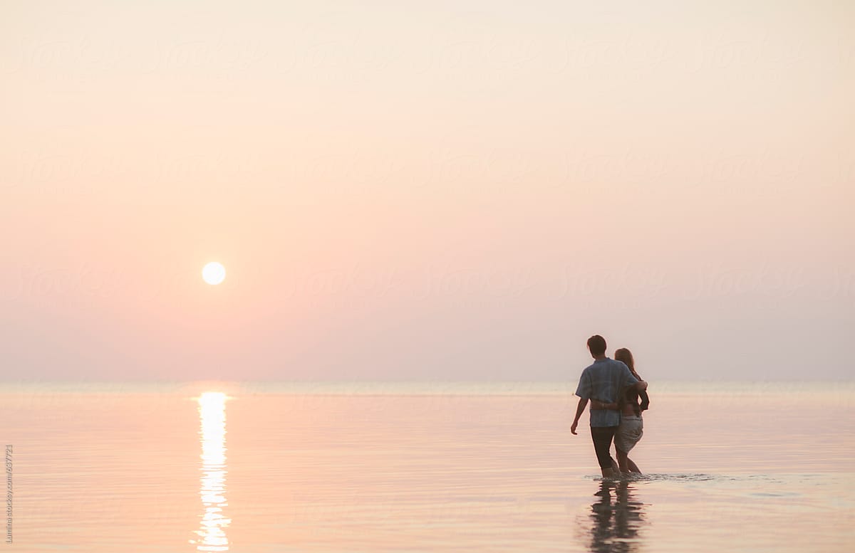 Couple in Love Walking in the Sea