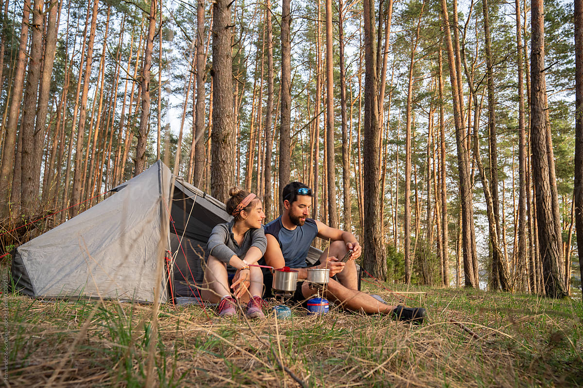 Happy Couple Camping In The Forest
