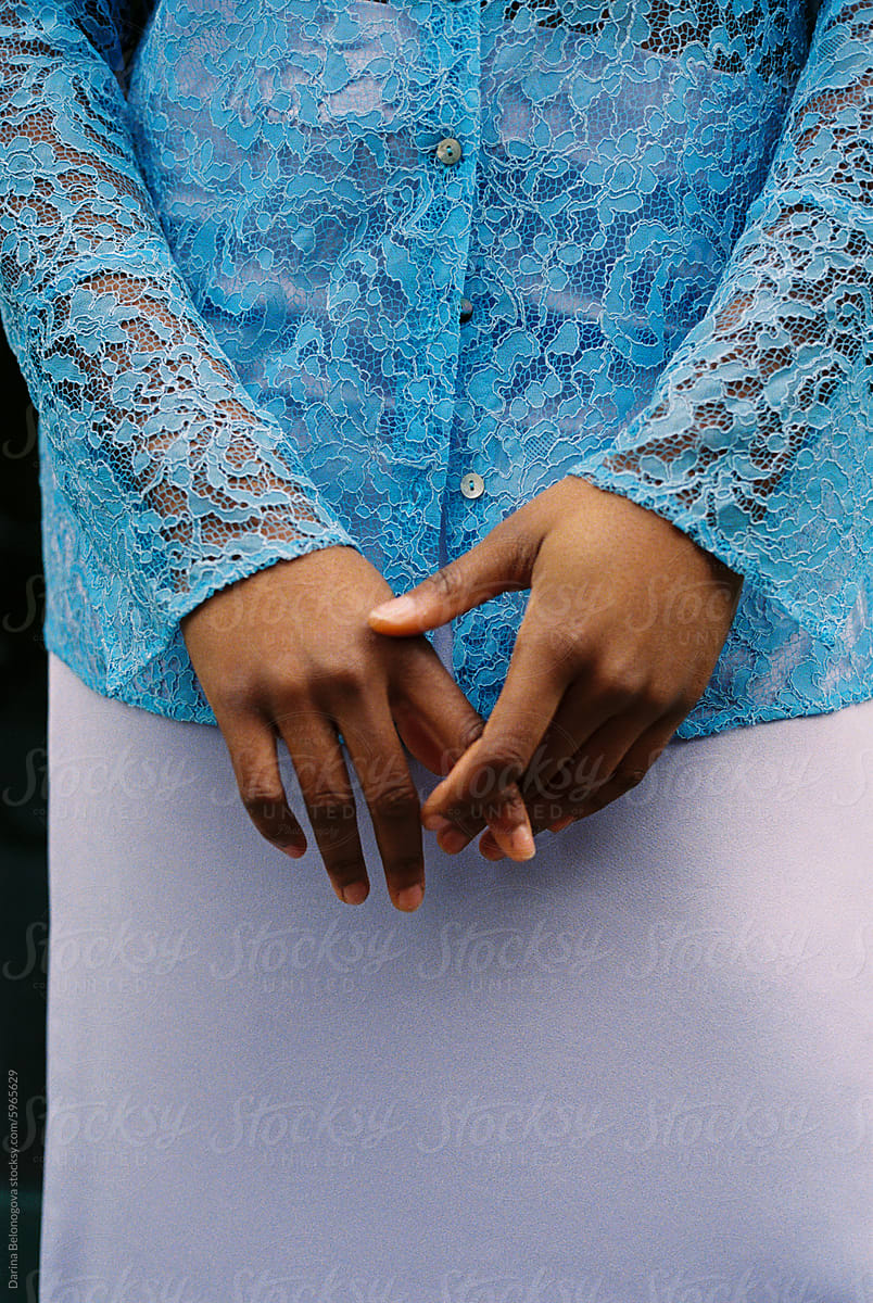 Black Woman With Hands Covering Her Skirt