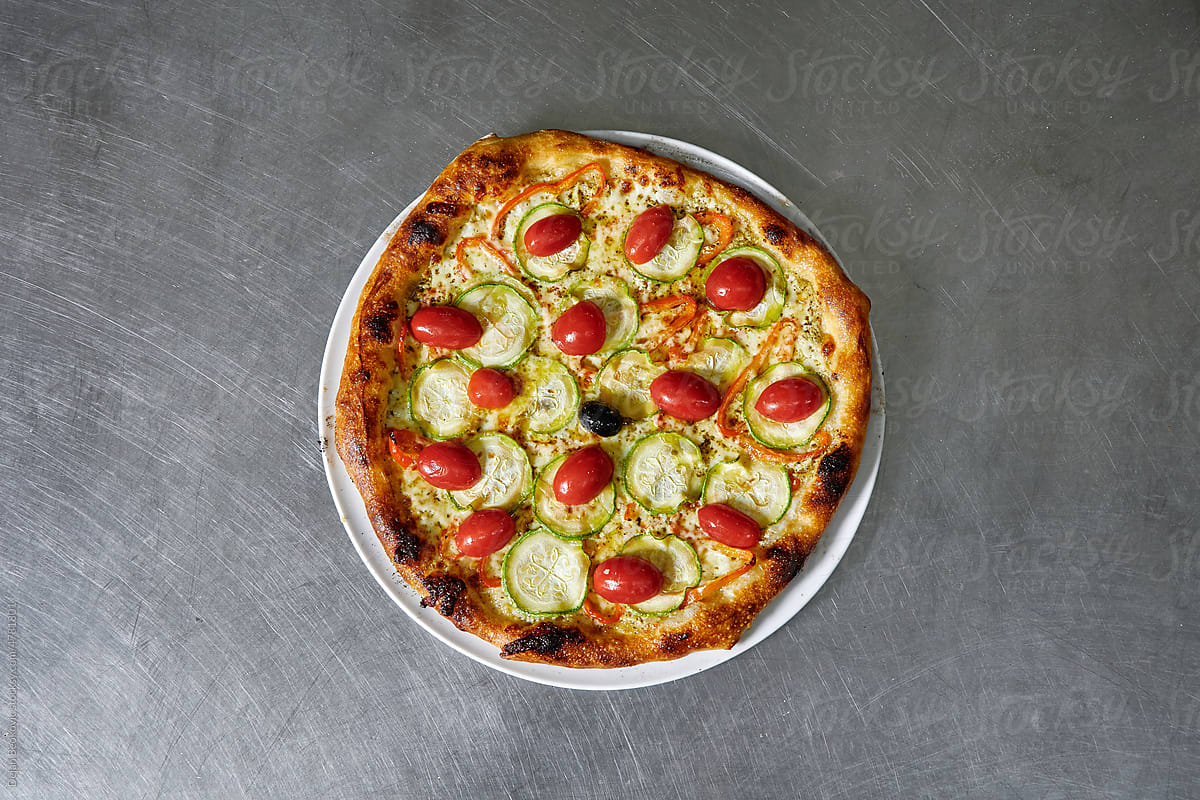 Zucchini Pizza With Cherry Tomatoes.