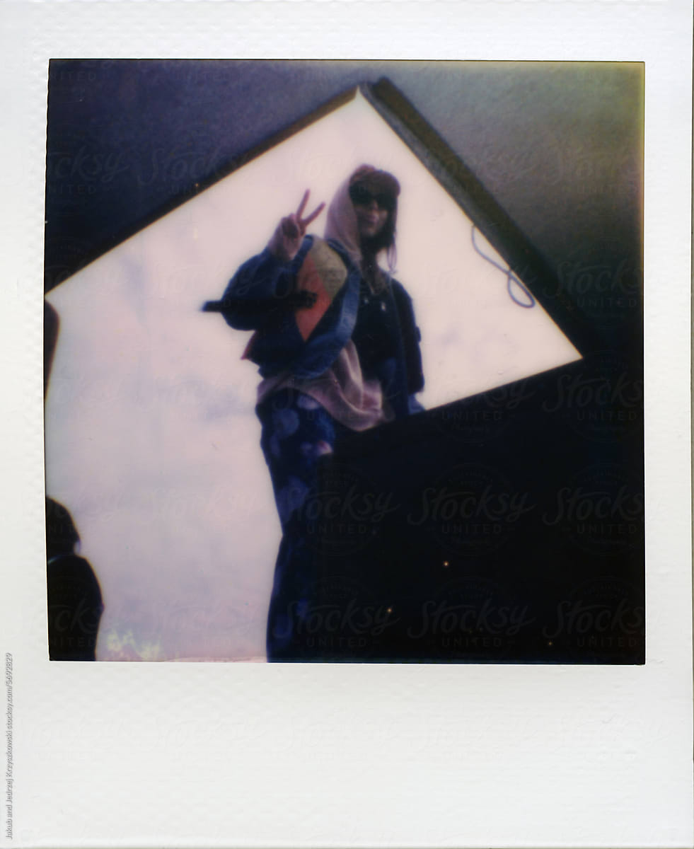 Girl sticks out a tongue on the boat (Polaroid)