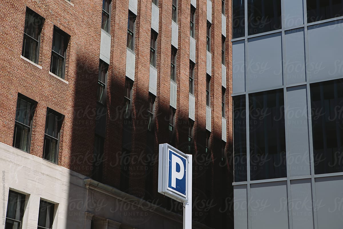 Parking sign among office buildings