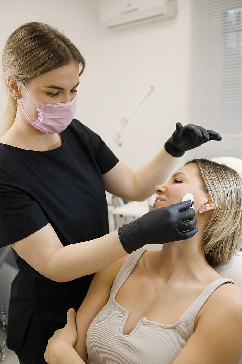 Cleaning the  face for a cosmetic procedures
