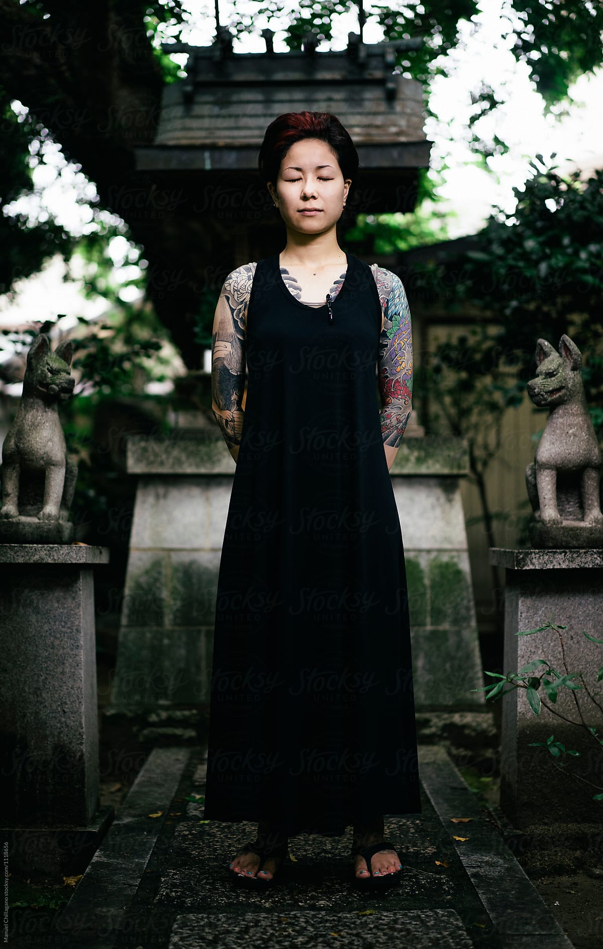 Tattooed Japanese Women Deeply Absorbed In Thought While Visiting