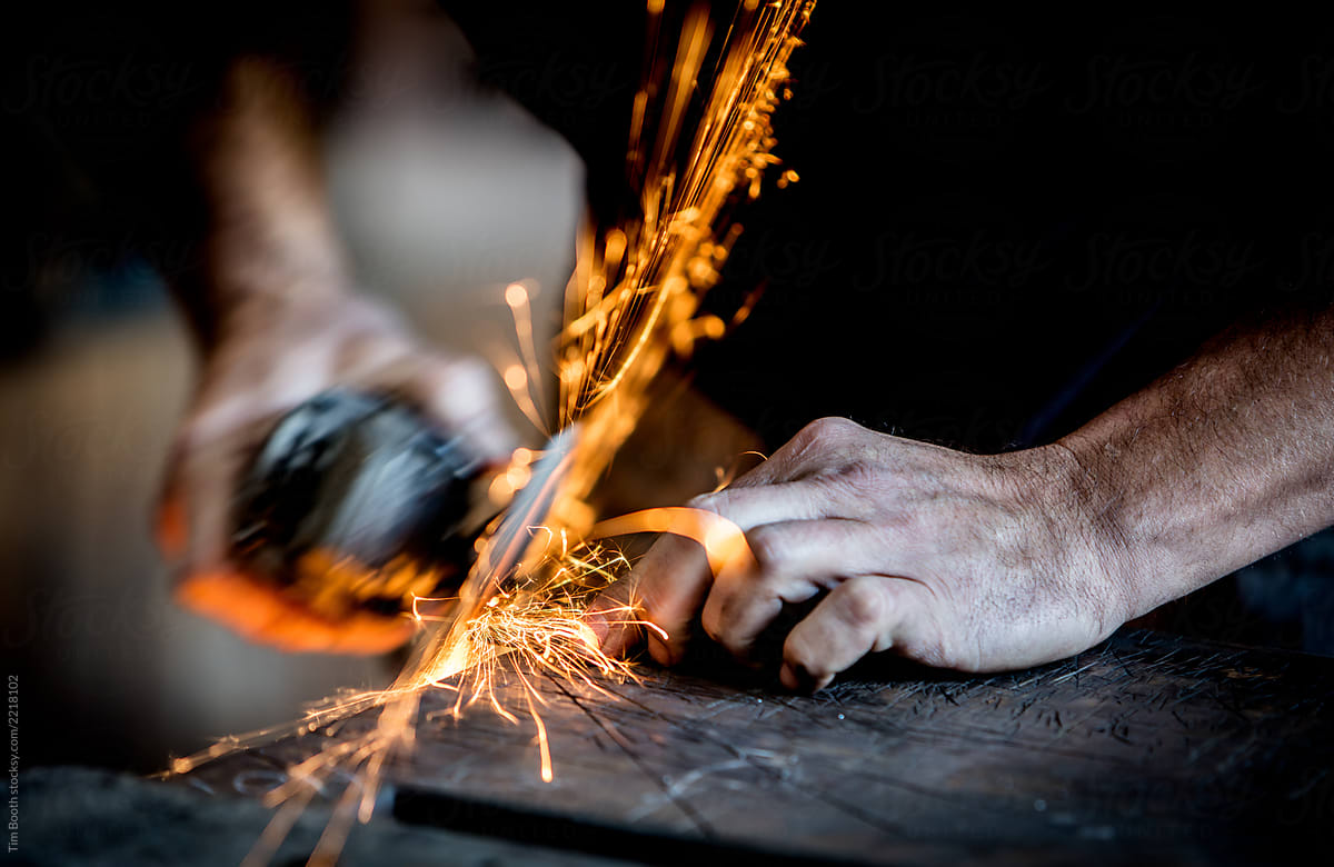 Sparks flying from a grinder in operation