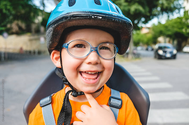 Toddler with Helmet on Rear Seat of a Bicycle, Child Safety
