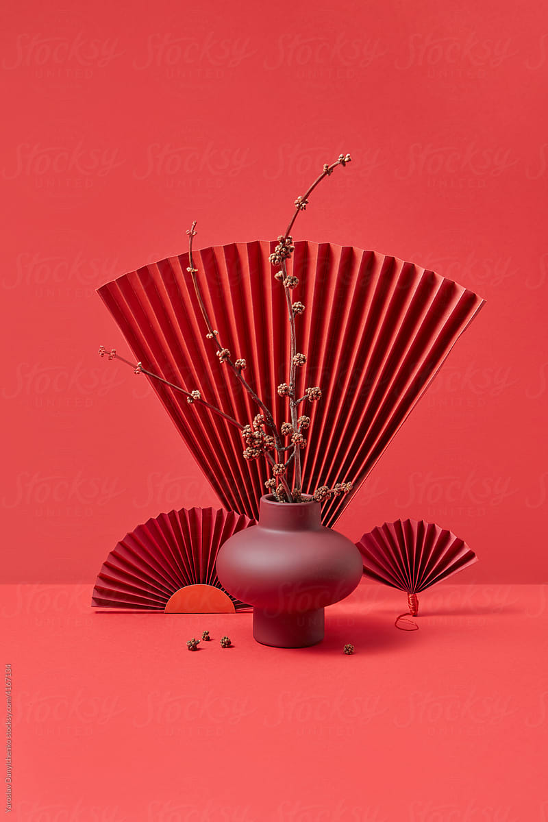Still life with dry twigs and origami fans