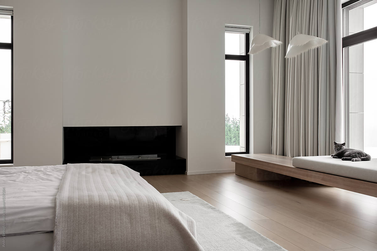 Interior of modern bedroom with white walls