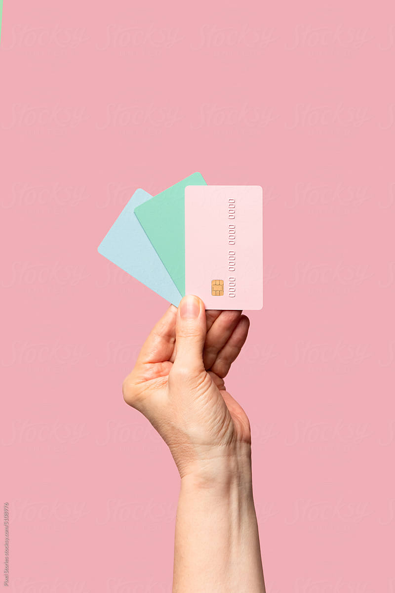 Hand holding credit / debit cards