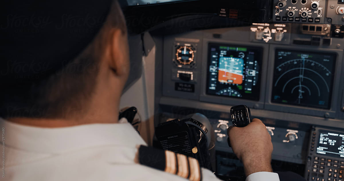 Captain controlling aircraft with helm