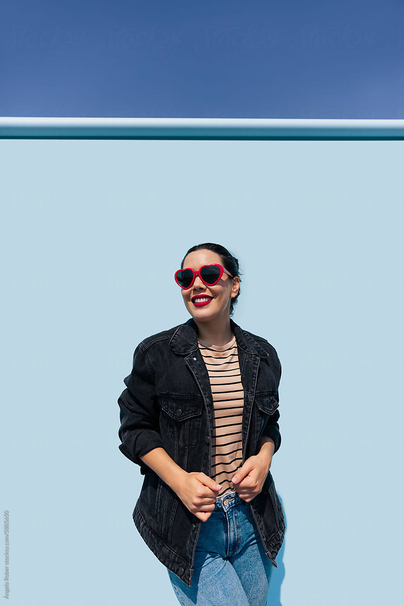 Trendy Woman in Denim Jacket and Sunglasses