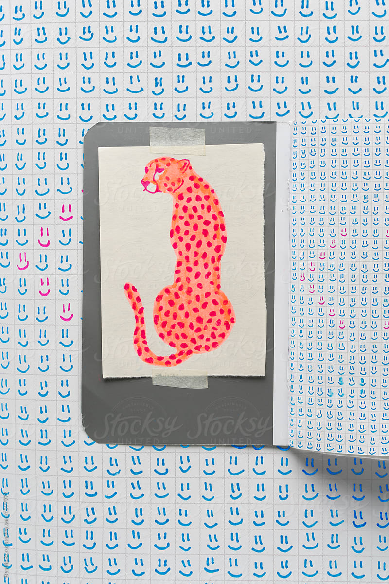 Handdrawn pink cheetah in a notebook
