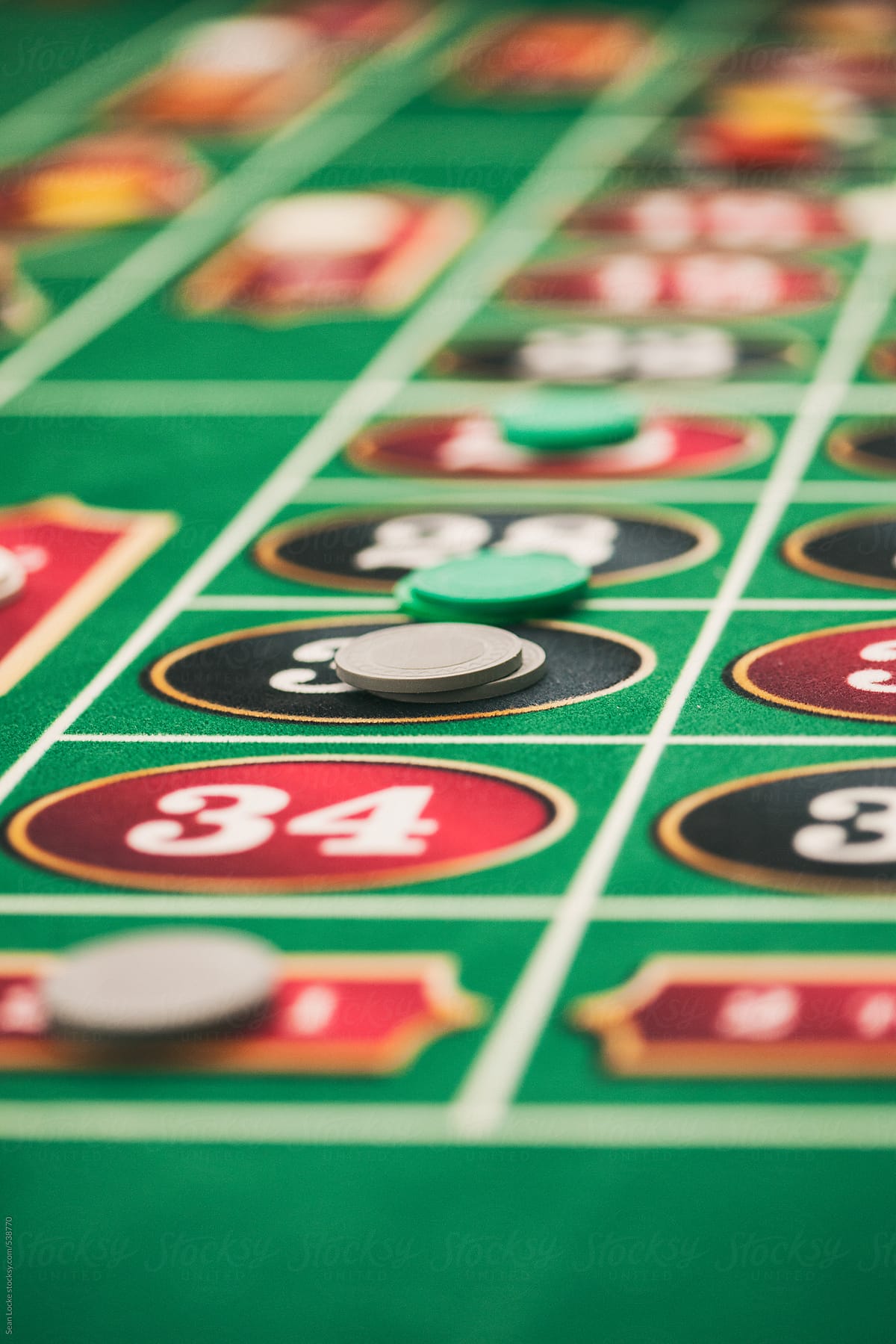 Casino: Chips Lay On Roulette Table For Various Numbers