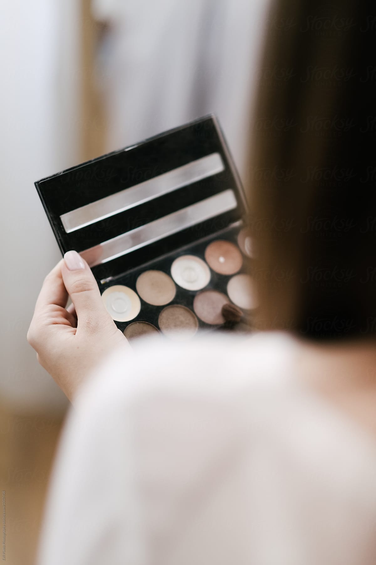 Anonymous Woman Holding A Make up Palette