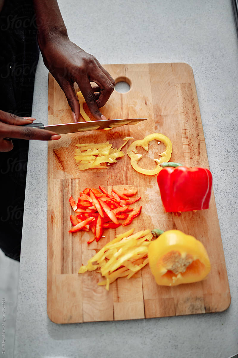 Person slicing vegetables for dish