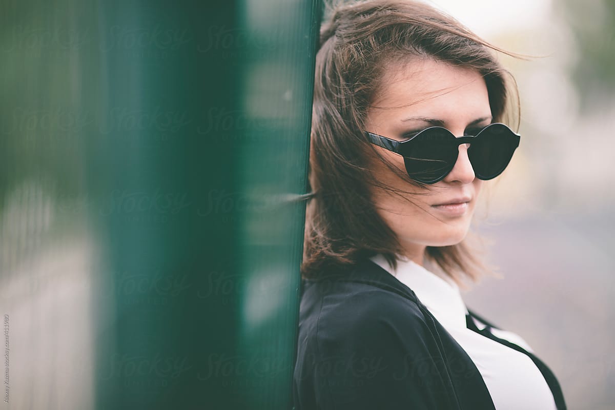 young woman with round sunglasses ,selective focus