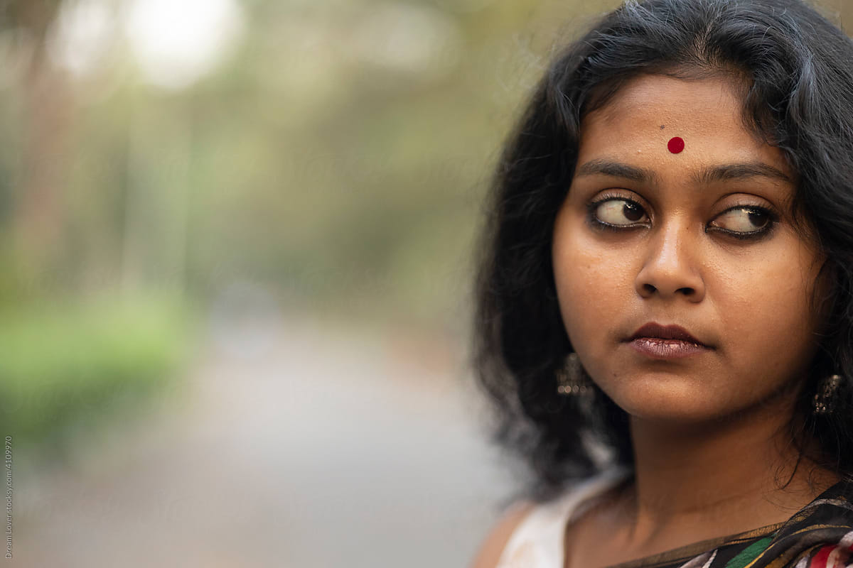 Portrait of a good looking young Indian woman at outdoor
