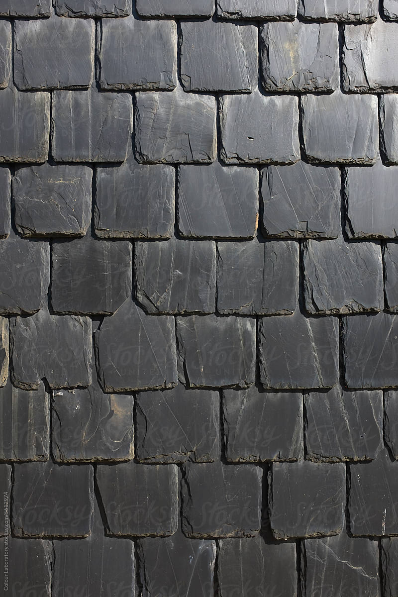 Black stone brick wall with lively light and pretty shadows