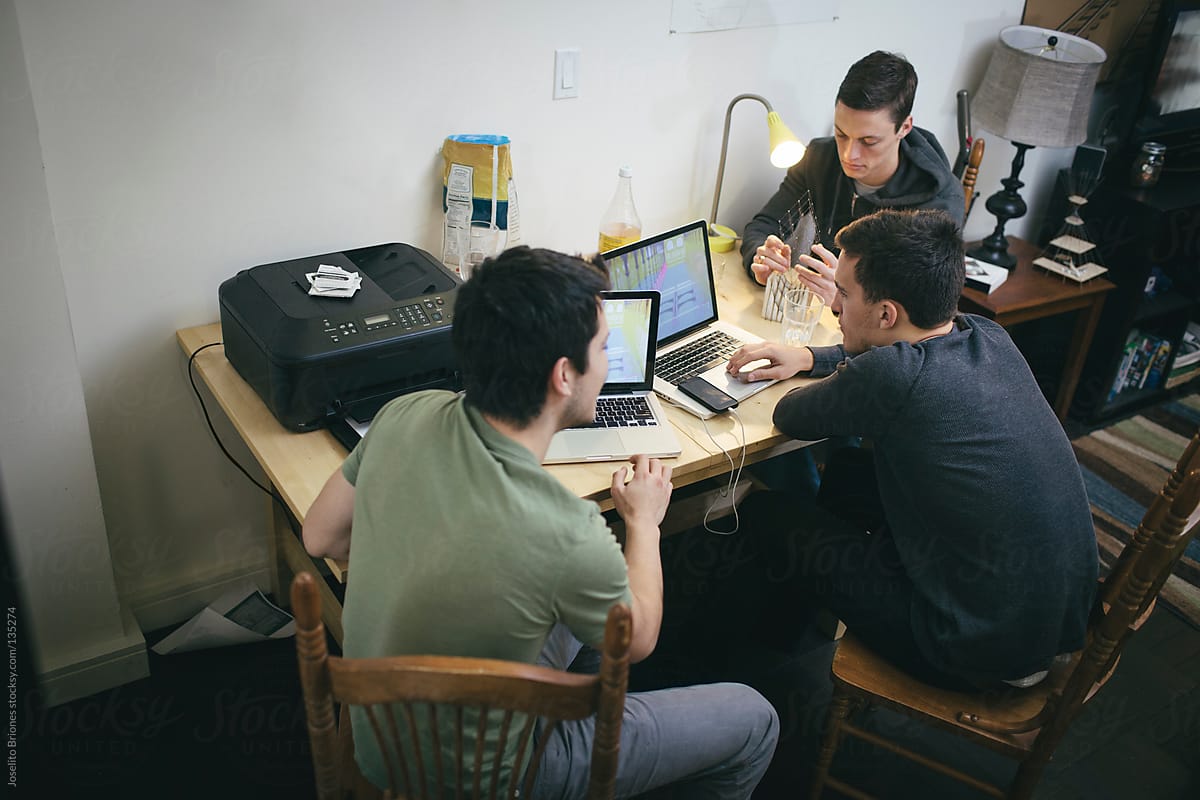 Architecture Students Discussing Structural and Computer Generated Models at Home