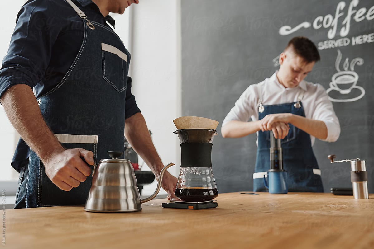 Baristas using pour over coffeemakers