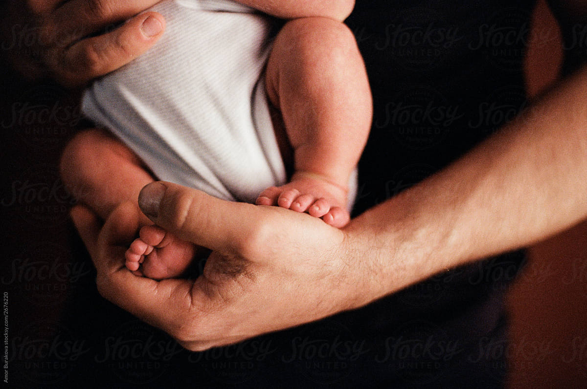 Man holding newborn boy