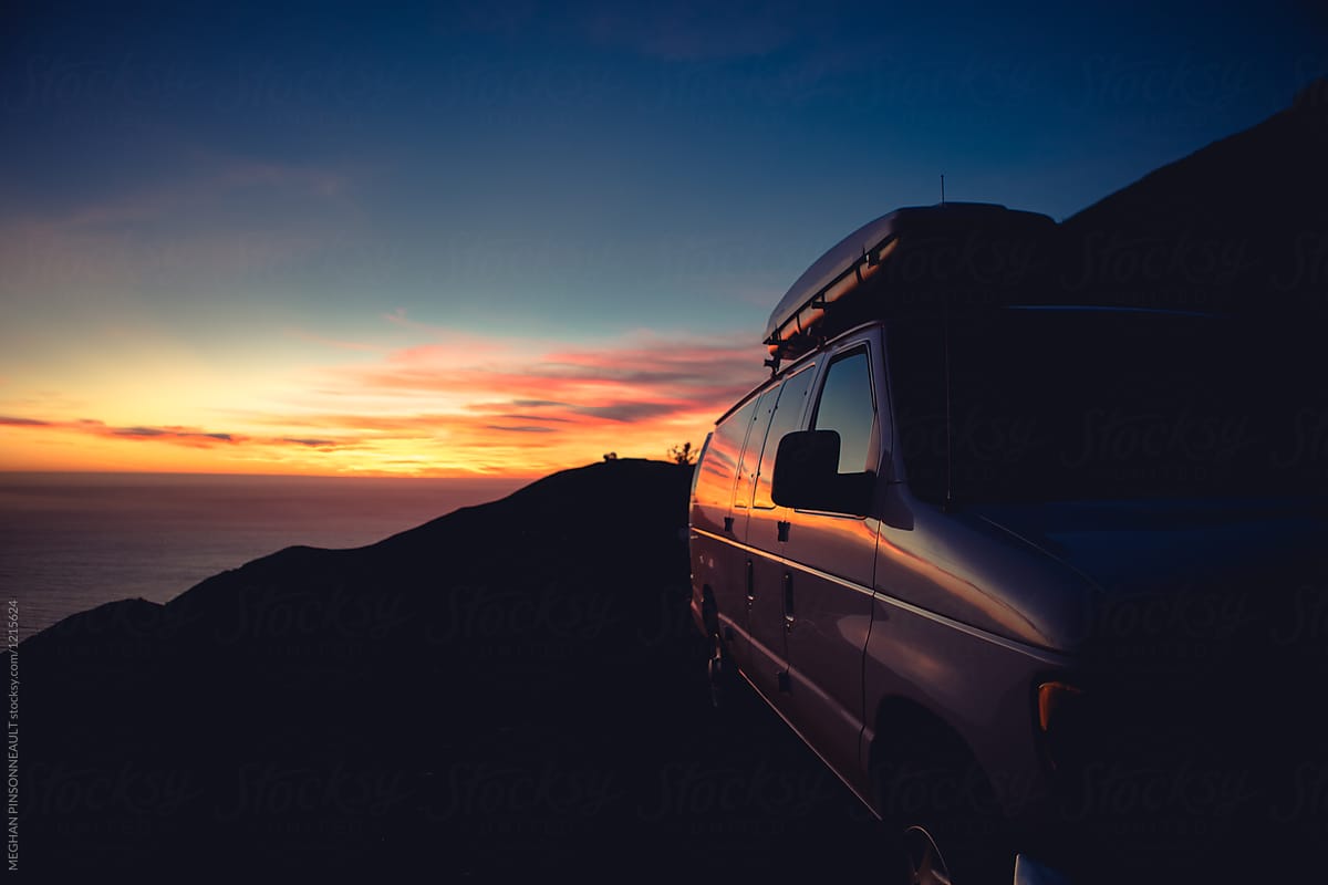 Beautiful Ocean Sunset Reflecting on White Adventure Van