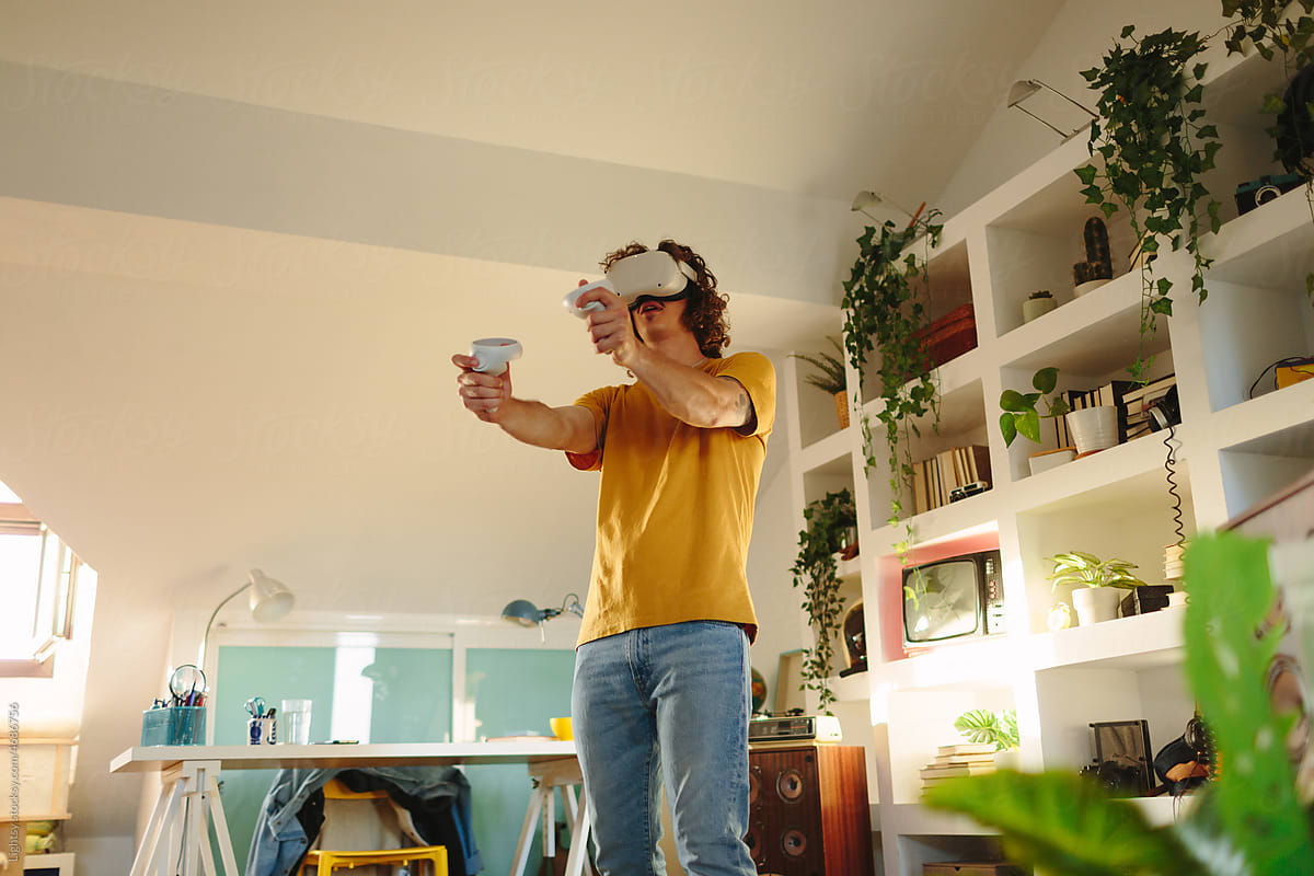 Man shooting while playing virtual reality games