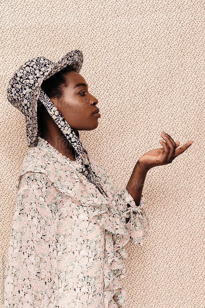 Young black woman in floral blouse