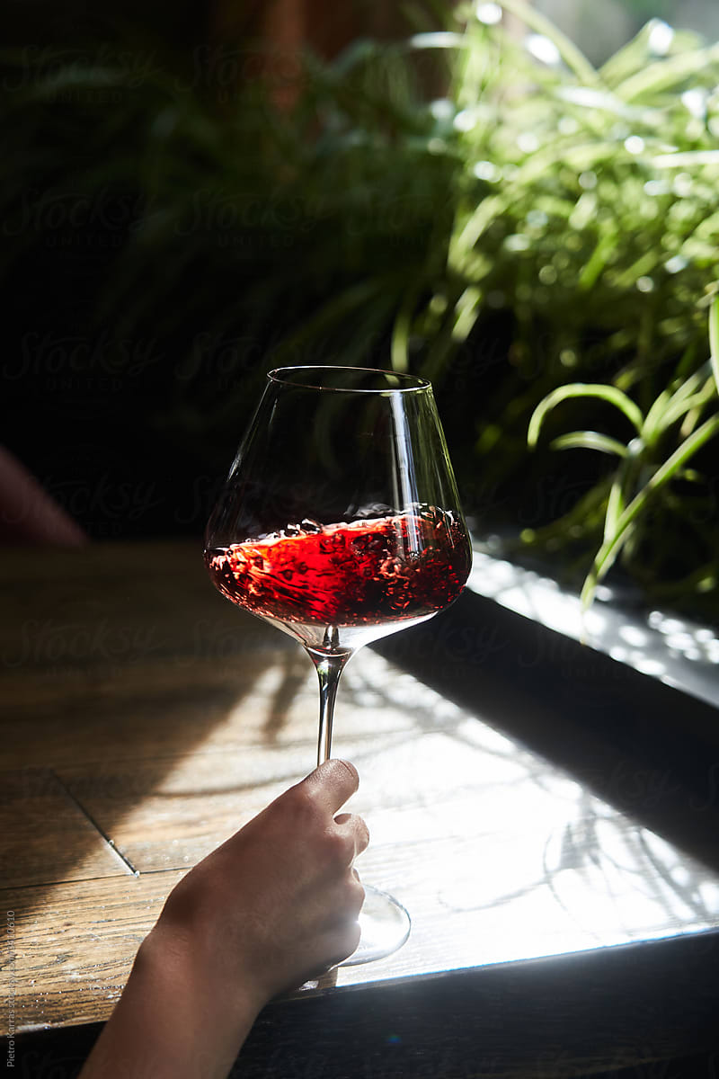 Woman drinking red wine on terrace