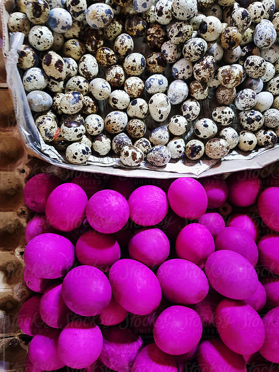 Quail eggs and salted eggs on a close-up.