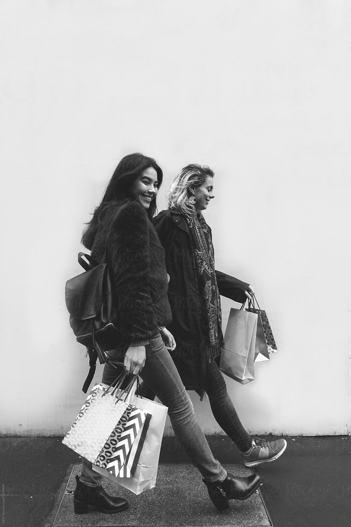 Young Female Best Friends Doing Shopping  on the Streets.
