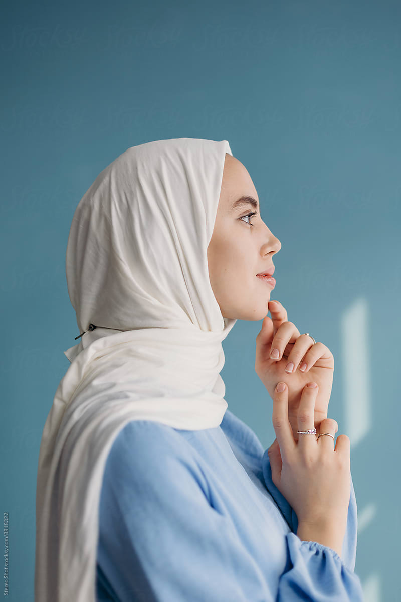 Dreamy Islamic model in hijab in studio
